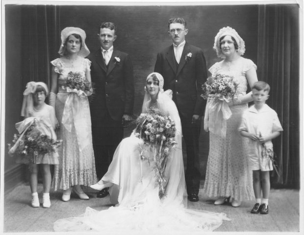 Wedding of Alfrida Kleinhenz and Edgar Willke on July 21, 1931, in St.Marys, Ohio. Standing L-R: Hilda Thieman, Pauline Kleinhenz, Al Willke, Edgar Willke, Hilda Kleinhenz, Jack Willke. Seated Alfrida (Klinhenz) Willke. The wedding was at Holy Rosary Church. The house was at the home of John W. Kleinhenz at 518 W. Jackson Street.